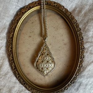 Kendra Scott Aiden long pendant necklace with a gold filigree design